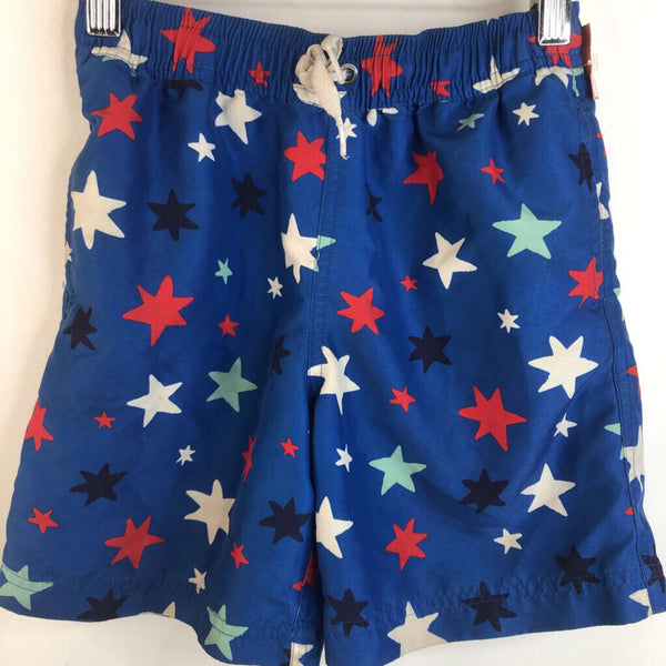 Size 6-7 (120): Hanna Andersson Blue Red & White Stars Swim Trunks