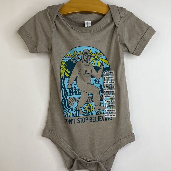 Size 6-12m: Bella + Canvas Light Brown/ Sasquach "Don't Stop Believing" Onesie-NEW W/Tag