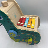Manhattan Toys Wooden Musical Dino